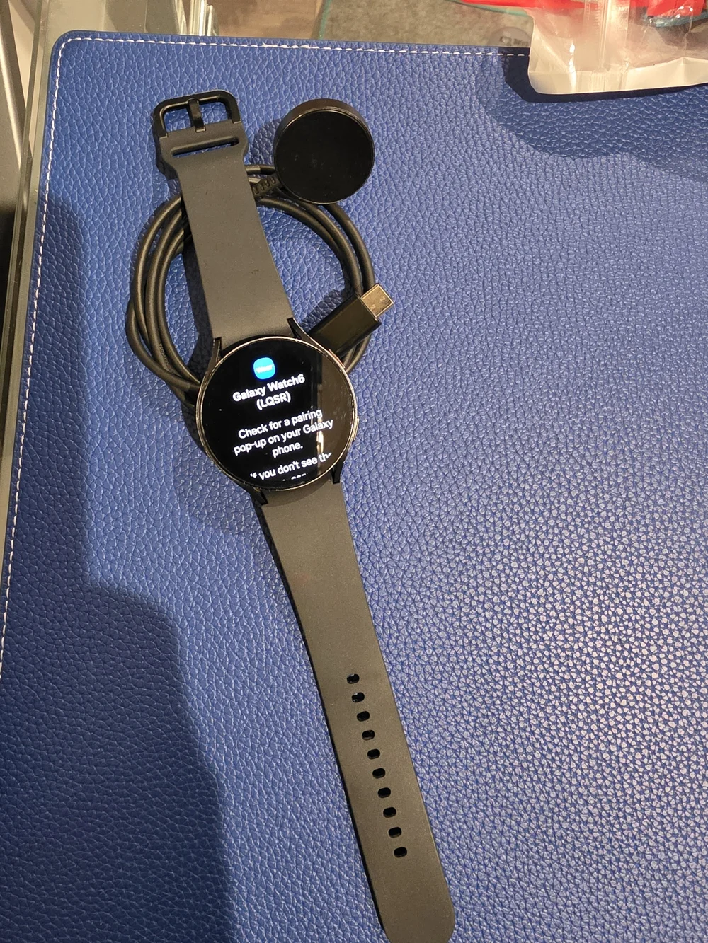 Black Round-Face Smartwatch with Charging Dock